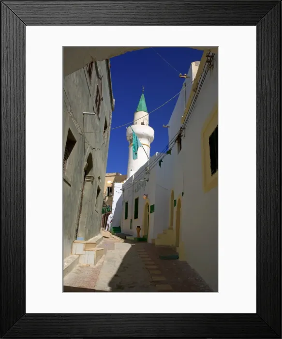 Framed Print : Tripoli, Libya; A minaret and the Libyan flag visible on one of the Mosques in the Ancient Medina of