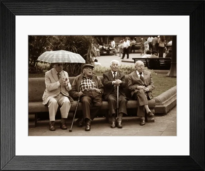 Framed Print : Ecuador, Quito. Four old men discuss events in a park in the Plaza de Armas