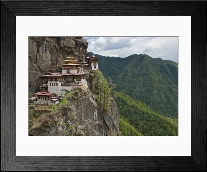 Framed Print : Taktshang Goemba, Tiger??s Nest??, is Bhutan??s most famous monastery. It is perched miraculously on the ledge of a sheer cliff 900 metres above the floor of the Paro Valley. Legend relates how Guru Rinpoche flew to the site on a tigress Framed Print : Taktshang Goemba, Tiger??s Nest??, is Bhutan??s most famous monastery. It is perched miraculously on the ledge of a sheer cliff 900 metres above the floor of the Paro Valley. Legend relates how Guru Rinpoche flew to the site on a tigress