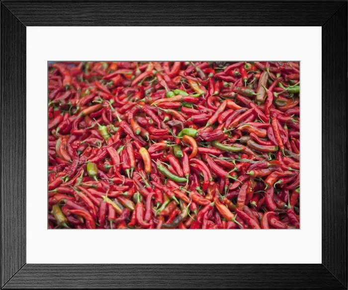 Framed Print : Red chillies for sale at Paro open-air market. Both red and green chillies are very important ingredients for Bhutanese food. The most popular Bhutanese dish is ema datsi a hot dish of green chillies cooked in cheese Framed Print : Red chillies for sale at Paro open-air market. Both red and green chillies are very important ingredients for Bhutanese food. The most popular Bhutanese dish is ema datsi a hot dish of green chillies cooked in cheese