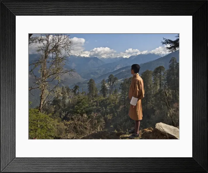 Framed Print : A Bhutanese man in national costume views an eastern Himalayan mountain range from the 11 Framed Print : A Bhutanese man in national costume views an eastern Himalayan mountain range from the 11