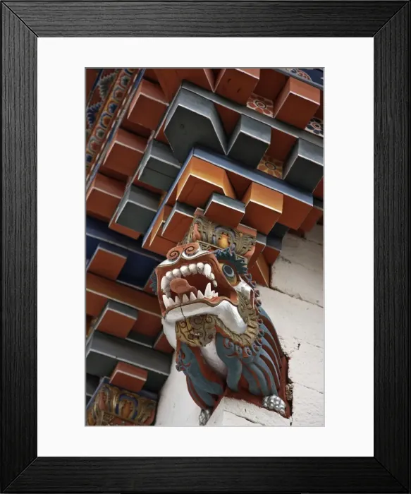 Framed Print : The architectural corner detail of the roof of a new temple near Kurjey Lhakhang with a carving of a dragon at its base. Bhutan is known as The Land of Dragons Framed Print : The architectural corner detail of the roof of a new temple near Kurjey Lhakhang with a carving of a dragon at its base. Bhutan is known as The Land of Dragons