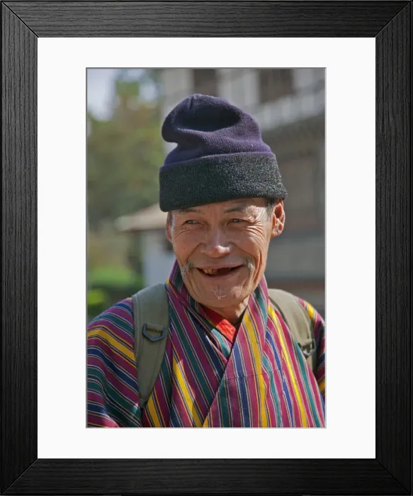 Framed Print : An old man at Trashigang wearing the traditional gho robe of all Bhutanese men Framed Print : An old man at Trashigang wearing the traditional gho robe of all Bhutanese men