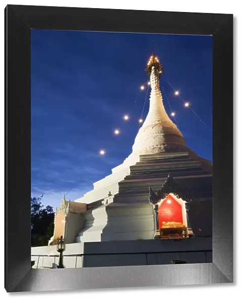 Thailand, Mae Hong Son, Mae Hong Son. Chedi at Wat Phra That Doi Kong Mu illuminated at night