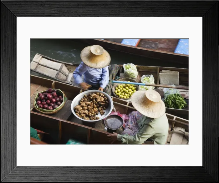 Framed Print : Thailand, Samut Songkhram, Damnoen Saduak. Women trade produce from their canoes at Damnoen Saduak - Thailands most famous