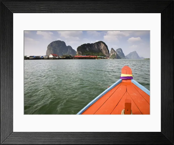 Framed Print : Thailand, Phang-Nga, Ko Panyi. The fishing village of Ko Panyi viewed from a long-tail boat