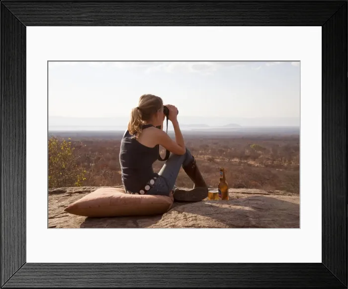 Framed Print : Tanzania, Tarangire. A woman looks out over the Tarangire National Park at sunset. MR Framed Print : Tanzania, Tarangire. A woman looks out over the Tarangire National Park at sunset. MR
