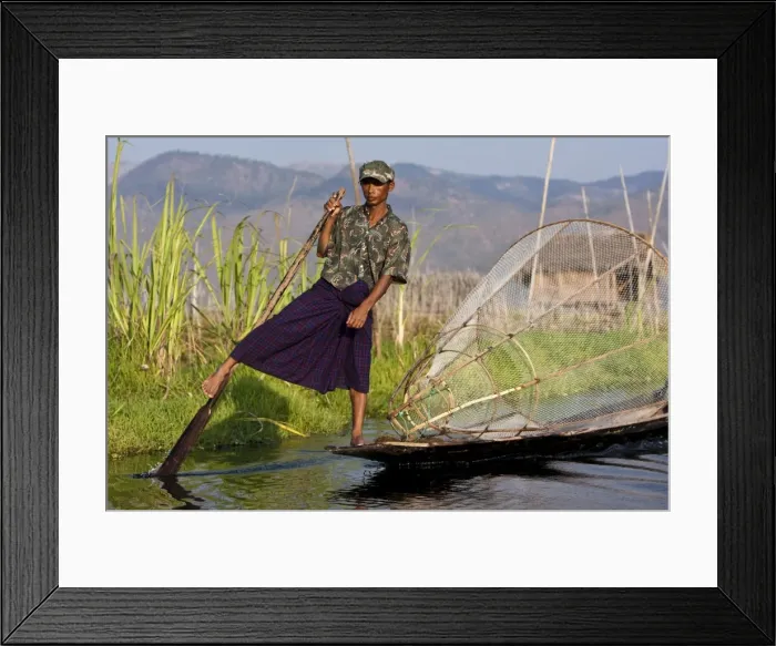 Framed Print : Myanmar, Inle Lake. Intha fisherman with traditional conical fish net, gently paddling his flat-bottomed Framed Print : Myanmar, Inle Lake. Intha fisherman with traditional conical fish net, gently paddling his flat-bottomed