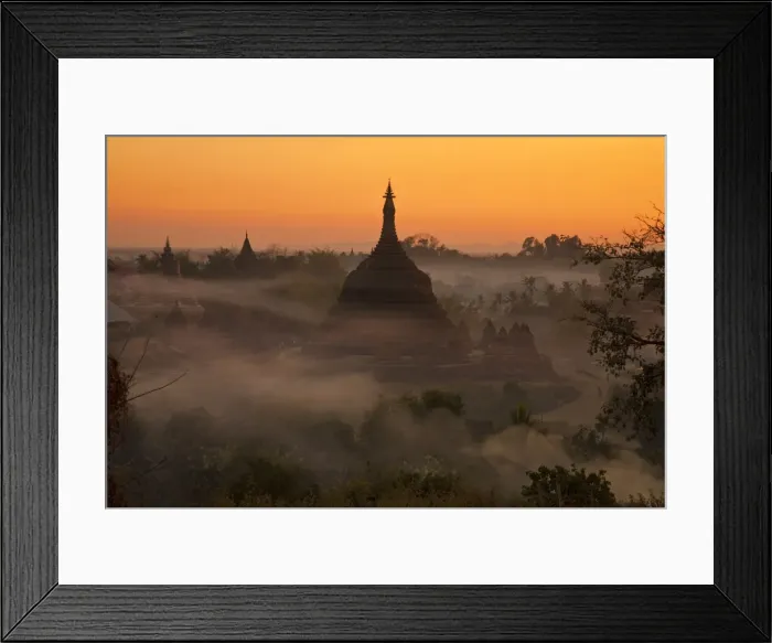 Framed Print : Myanmar, Burma, Mrauk U. Evening mist and smoke from village cooking fires swirl around Ratanabon Paya, Mrauk U