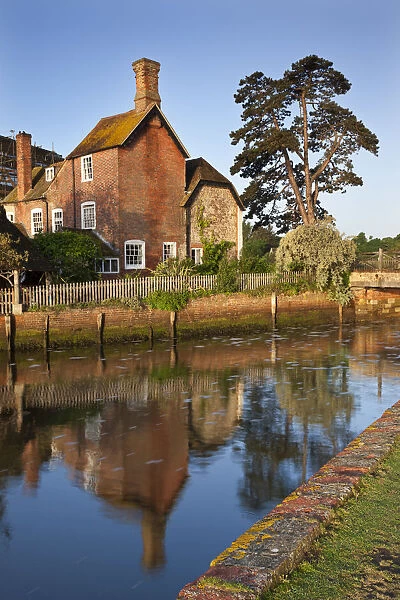 The 16th Century Mill House beside Beaulieu River, New Forest, Hampshire, England. Spring
