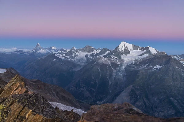The 4000 peaks of Zermatt valley just before sunrise from Nadelgrat