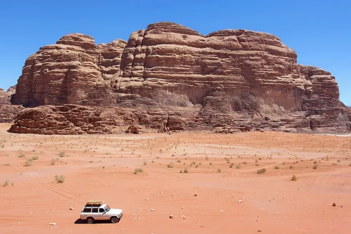 Framed Print : A 4x4 off-road vehicle car in the Wadi Rum desert, Aqaba, Jordan, Middle East. Declared a UNESCO World Heritage Site since 2011
