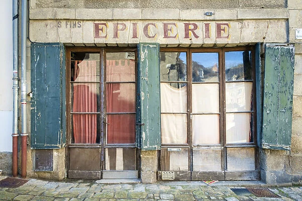 Abandoned storefront vintage painted sign of old Epicerie market store, Aubusson