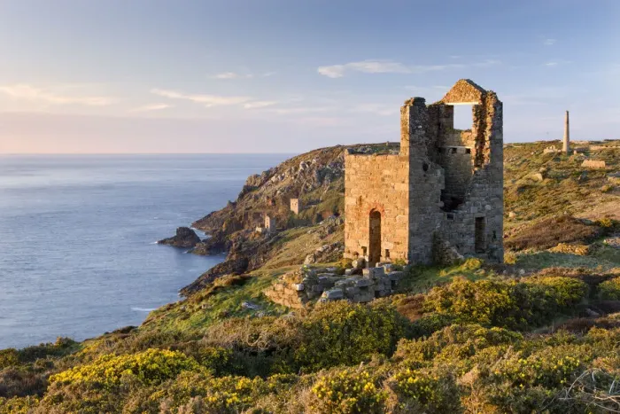 Framed Print : Abandoned tin mine engine houses and chimney stacks lie scattered over the clifftops at Botallack, St Just, Cornwall, England. Spring (April) 2010