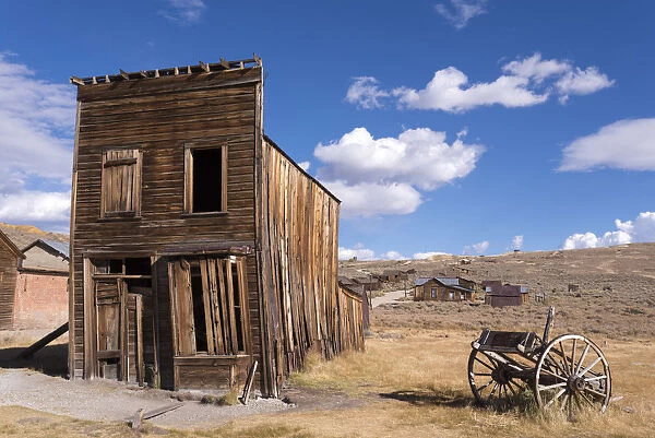 Abandoned wooden house and wagon in Bodie ghost Town, California, USA