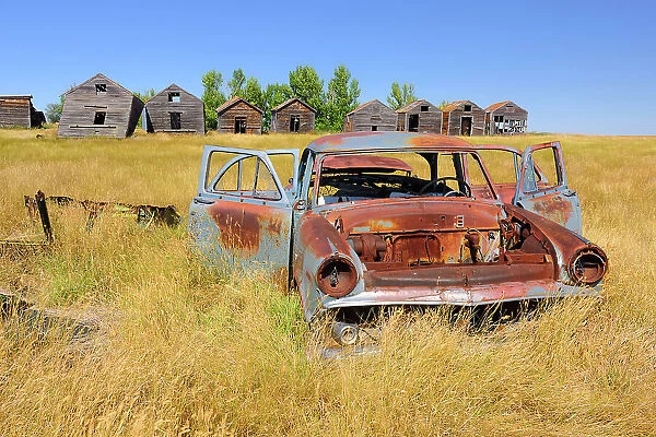 Abandonned car and graneries Rosetown Saskatchewan, Canada