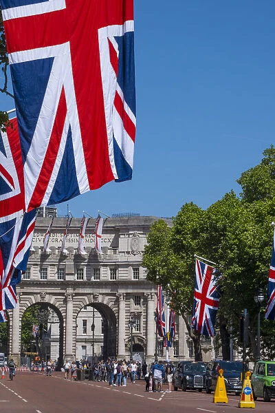 Admiralty Arch & Union Jack flags along The Mall, London, England, UK