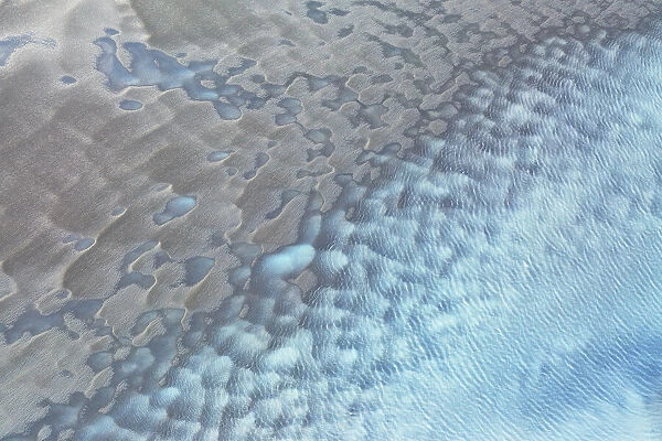 aerial abstract taken by drone of icelandic river during a winter day, Austurland, Iceland