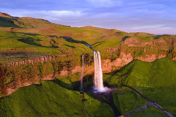 Aerial drone view of Seljalandsfoss waterfall at sunset, Iceland