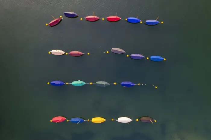 Framed Print : Aerial image of colourful boats moored in a harbour, Cornwall, England