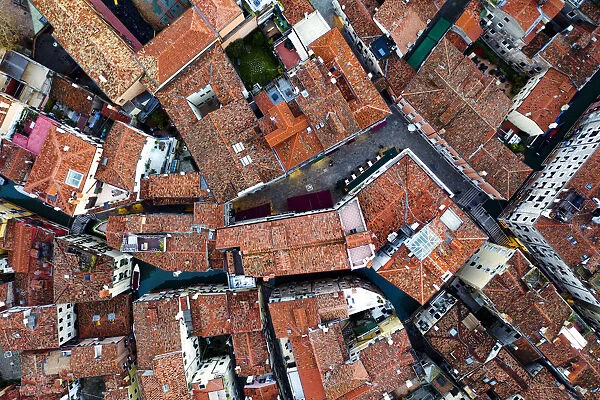 Aerial overhead view of houses and canal, Venice, Italy