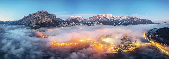Framed Print : Aerial panoramic of the illuminated town of Lecco and mountains under the foggy sky at dusk, Lake Como, Lombardy, Italy Framed Print : Aerial panoramic of the illuminated town of Lecco and mountains under the foggy sky at dusk, Lake Como, Lombardy, Italy