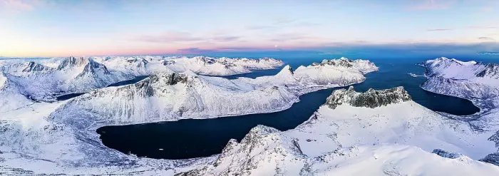 Framed Print : Aerial panoramic view of Grytetippen mountain covered with snow overlooking the frozen Ornfjord, Senja, Troms county, Norway Framed Print : Aerial panoramic view of Grytetippen mountain covered with snow overlooking the frozen Ornfjord, Senja, Troms county, Norway