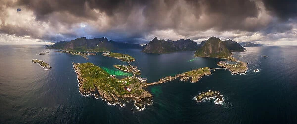 An aerial panoramic view of the whole Reine fjord on a stormy afternoon. Lofoten Islands, Norway