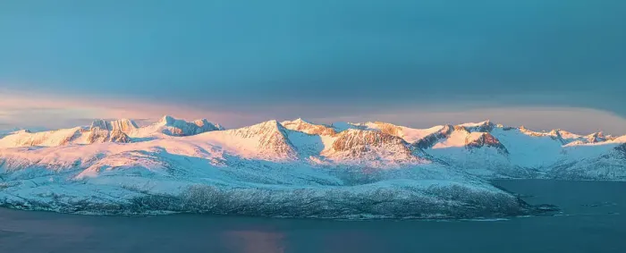 Framed Print : Aerial panoramic view of Senja mountain peaks covered with snow at dawn from Sommaroy, Troms county, Norway Framed Print : Aerial panoramic view of Senja mountain peaks covered with snow at dawn from Sommaroy, Troms county, Norway