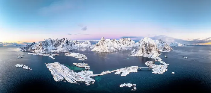 Framed Print : Aerial panoramic view of snowcapped mountains and Reine Bay facing the icy sea in winter, Reine, Lofoten Islands, Norway Framed Print : Aerial panoramic view of snowcapped mountains and Reine Bay facing the icy sea in winter, Reine, Lofoten Islands, Norway