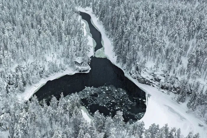 Framed Print : Aerial of riverside hut & snow-covered forest, Oulanka National Park, Finland Framed Print : Aerial of riverside hut & snow-covered forest, Oulanka National Park, Finland