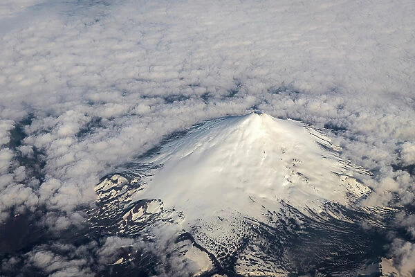 Aerial of snow-covered volcano, Chile