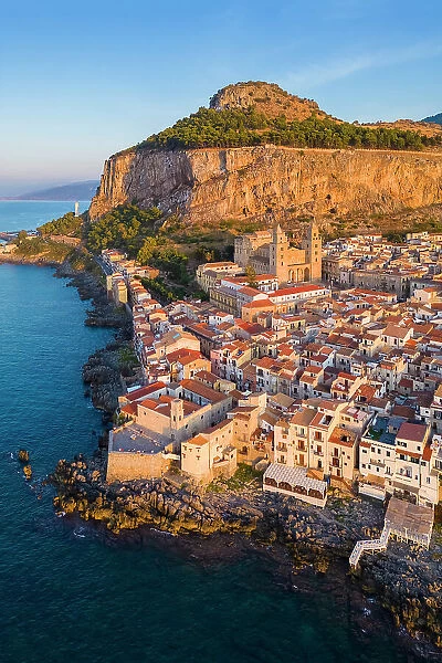 Aerial view of the ancient town of Cefalu, Unesco World Heritage site, at sunset. Palermo district, Sicily, Italy