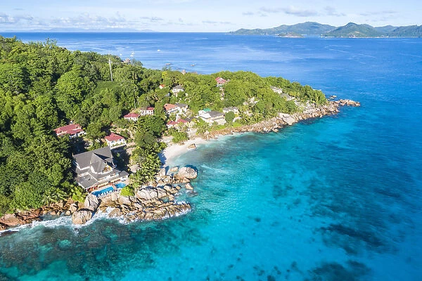 Aerial view of Anse Patates and Patatran village. La Digue island, Seychelles, Africa
