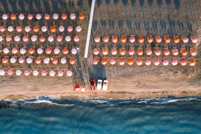 Framed Print : Aerial view of beach umbrellas in a row on sand beach washed by waves, Vieste Framed Print : Aerial view of beach umbrellas in a row on sand beach washed by waves, Vieste