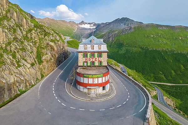 Aerial view of the Belvedere Hotel and the Furka Pass road, famous for a scene of the James Bond film Goldfinger, a high mountain pass in the Swiss Alps connecting Gletsch, Valais with Realp, Uri. Obergoms, Canton of Valais, Swiss Alps, Switzerland