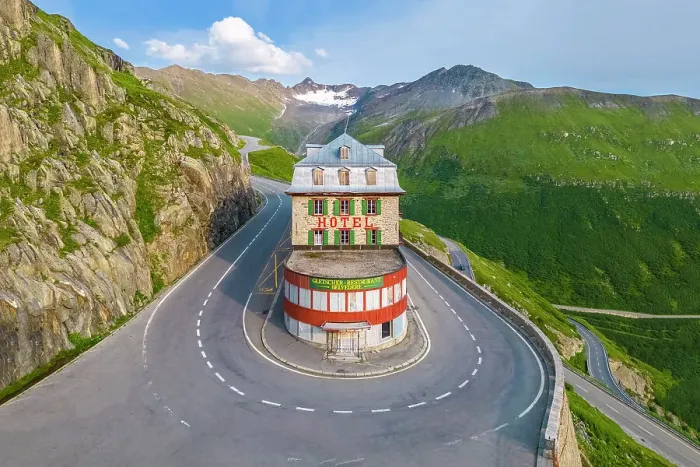 Framed Print : Aerial view of the Belvedere Hotel and the Furka Pass road, famous for a scene of the James Bond film Goldfinger, a high mountain pass in the Swiss Alps connecting Gletsch, Valais with Realp, Uri. Obergoms, Canton of Valais, Swiss Alps, Switzerland Framed Print : Aerial view of the Belvedere Hotel and the Furka Pass road, famous for a scene of the James Bond film Goldfinger, a high mountain pass in the Swiss Alps connecting Gletsch, Valais with Realp, Uri. Obergoms, Canton of Valais, Swiss Alps, Switzerland