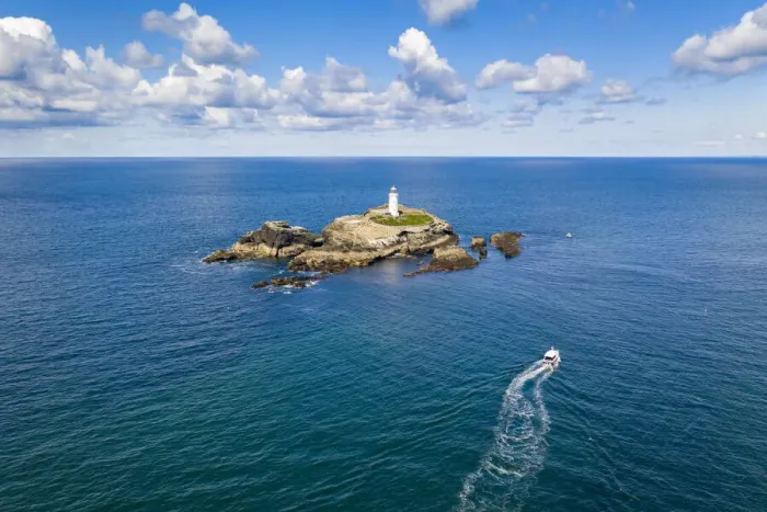 Framed Print : Aerial view of boat approaching Godrevy lighthouse and island, St Ives Bay, Cornwall Framed Print : Aerial view of boat approaching Godrevy lighthouse and island, St Ives Bay, Cornwall