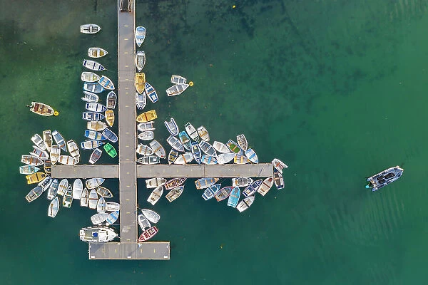 Aerial view of boats tethered to a jetty on the River Yealm Estuary, Newton Ferrers, Devon, England. Spring (April) 2022