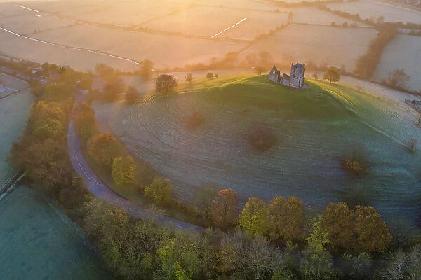 Aerial view of Burrow Mump and the ruins of St Michael's Church on a frosty autumn morning, Burrowbridge, Somerset, England. Autumn (November) 2021