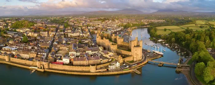 Framed Print : Aerial view of Caernarfon Castle and town on a sunny spring evening, Caernarfon, North Wales, UK. Spring (May) 2023 Framed Print : Aerial view of Caernarfon Castle and town on a sunny spring evening, Caernarfon, North Wales, UK. Spring (May) 2023