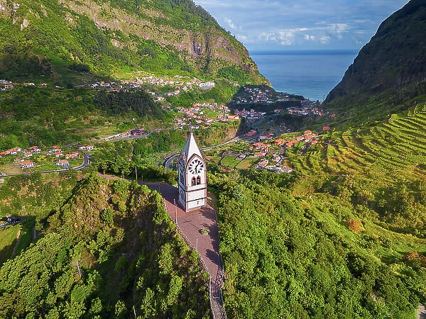 Aerial view of Capelinha de Nossa Senhora de Fatima surrounded by terraced fields at sunrise, Sao Vicente, Madeira, Portugal