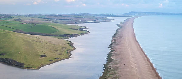 Aerial view of Chesil Beach and the Fleet lagoon near Abbotsbury on a cold winter day, Dorset, England. Winter (January) 2024
