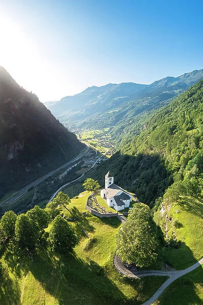 Aerial view of the church of Calonico, dominating Leventina valley towards San Gottardo pass. Calonico, district of Leventina, Canton of Ticino, Switzerland