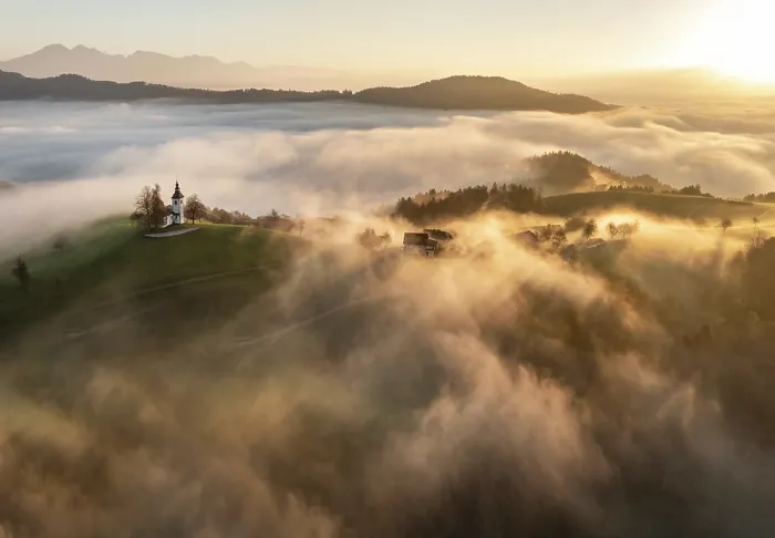 Framed Print : Aerial view of the Church of St. Thomas in mist at dawn, in autumn, Skofja Loka, Slovenia Framed Print : Aerial view of the Church of St. Thomas in mist at dawn, in autumn, Skofja Loka, Slovenia