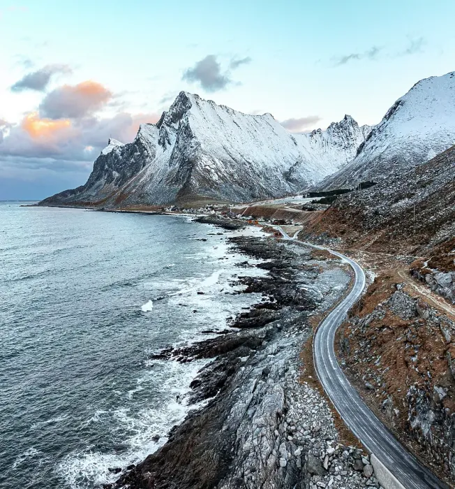 Framed Print : Aerial view of a coastal road running by the cold fjord to the fishing village of Vikten, Flakstad, Lofoten Islands, Norway Framed Print : Aerial view of a coastal road running by the cold fjord to the fishing village of Vikten, Flakstad, Lofoten Islands, Norway