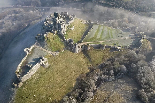 Aerial view of Corfe Castle on a chill winter morning, Dorset, England. Winter (February) 2023