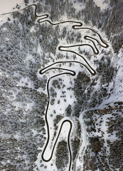Aerial view of curves of the Maloja pass after a snowfall, Maloja Pass, Bregaglia Valley