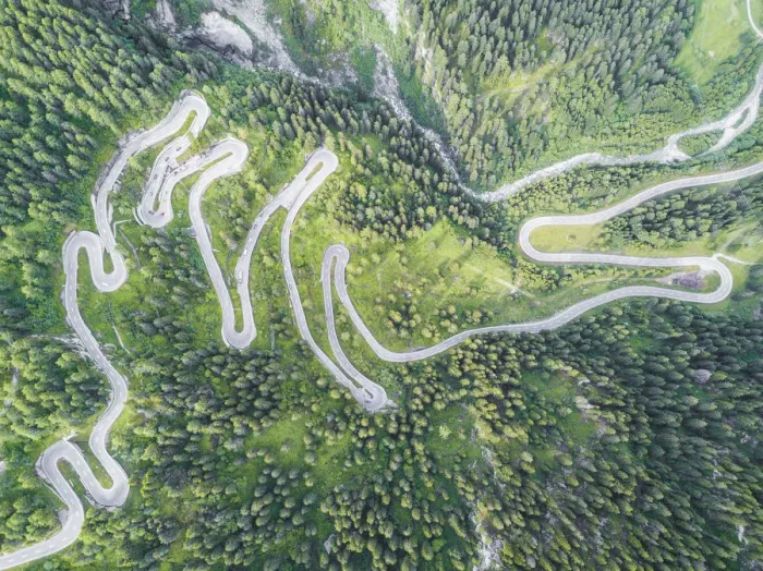 Framed Print : Aerial view of curves of the road between woods, Maloja Pass, Bregaglia Valley, canton