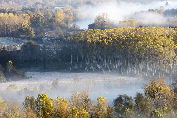 Aerial view of the Dordogne Valley & Dordogne river on a misty morning in autumn